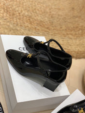 TRIOMPHE T-BAR HIGH PUMPS IN BLACK PATENT CALFSKIN