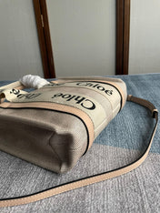 SMALL STRAP WOODY TOTE BAG 26.5 IN BEIGE LINEN CANVAS BLACK WEBBING LOGO EMBROIDER NUDE CALFSKIN
