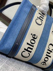 SMALL STRAP WOODY TOTE BAG 26.5 IN BLUE DENIM CANVAS DARK BLUE CALFSKIN