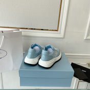 PRADA 25S THICK SOLE SNEAKER IN LIGHT BLUE CALFSKIN AND CANVAS