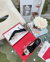 EFFLORESCENCE POINTED-TOE PUMPS IN BLACK SATIN WITH CRYSTAL BUCKLE