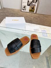 WOODY MULE IN BLACK LAMBSKIN WITH EMBROIDERED LOGO