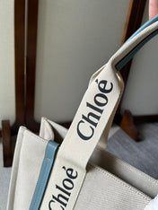 LAGRE WOODY TOTE BAG 45 IN BEIGE LINEN CANVAS BLACK WEBBING LOGO EMBROIDER BLUE CALFSKIN