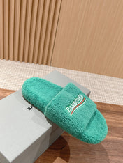 FURRY SLIDES IN TURQUOISE CURLY SHEARLING