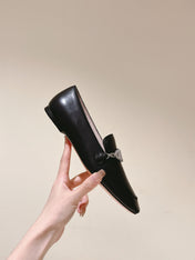 STRASS CHAIN LOAFERS IN BLACK CALFSKIN WITH CRYSTAL CHAIN DETAIL