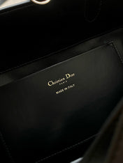 MEDIUM TOUJOURS BUCKET BAG 22 IN BLACK CANNAGE CALFSKIN