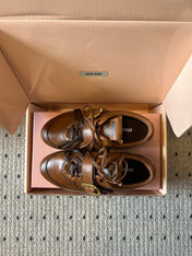 MIUMIU 26S GYMNASIUM SNEAKER IN COGNAC BROWN CALFSKIN WITH GOLD BUCKLED STRAP
