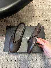 BOTTEGA VENETA 26S FLAT MULES IN DARK BROWN LAMBSKIN