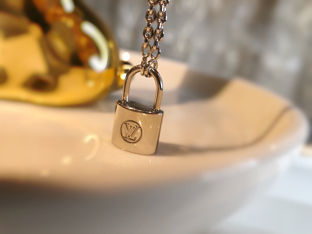 LV CHARITY LOCK NECKLACE