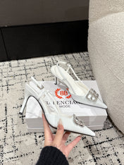 POINTED HIGH SLINGBACK IN WHITE PATENT CALFSKIN WITH CRYSTAL BUCKLE