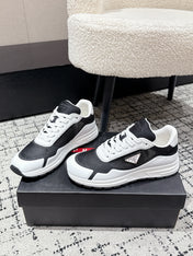 PRADA 25S MEN SNEAKERS IN BLACK AND WHITE CANVAS
