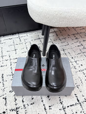 PRADA 26S SLIP ON SHOES IN BLACK SMOOTH CALFSKIN