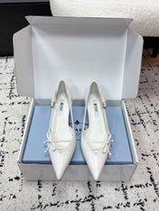 PRADA 26S POINTED-TOE HIGH HEELS 55MM IN WHITE CALFSKIN WITH BOW