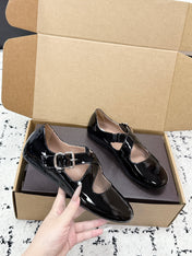 ALAIA 26S CROSS-STRAP BALLET FLATS IN BLACK GLOSSY LAMBSKIN