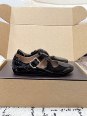ALAIA 26S CROSS-STRAP BALLET FLATS IN BLACK GLOSSY LAMBSKIN