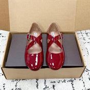 ALAIA 26S CROSS-STRAP BALLET FLATS IN RED GLOSSY LAMBSKIN