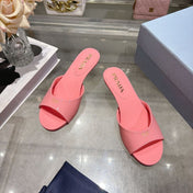 PRADA 26S LOGO EMBOSSED KITTEN HEEL MULES IN PINK PATENT CALFSKIN