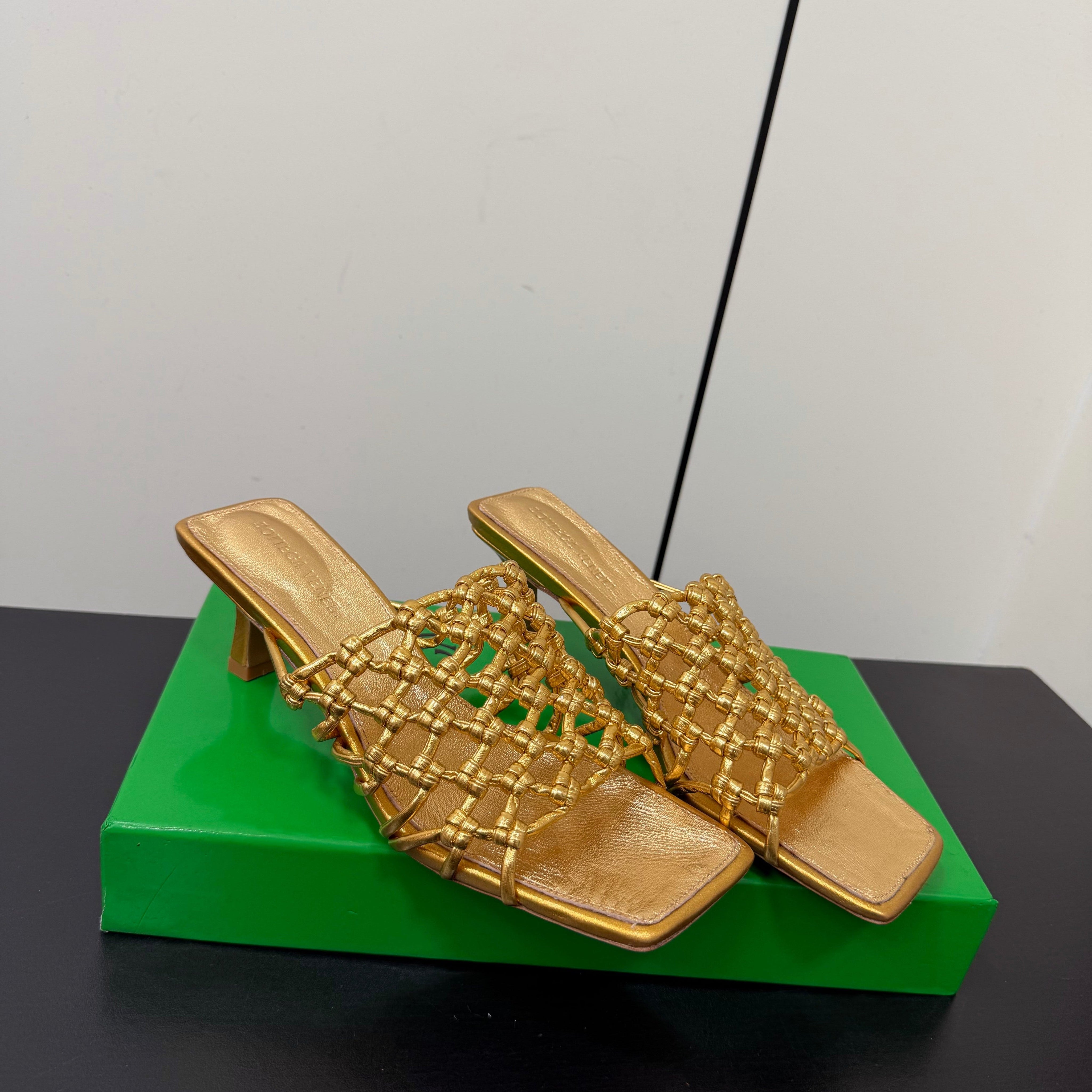 BOTTEGA VENETA 26S WOVEN STRAP HIGH-HEEL SANDALS 55 MM IN GOLD LAMBSKIN