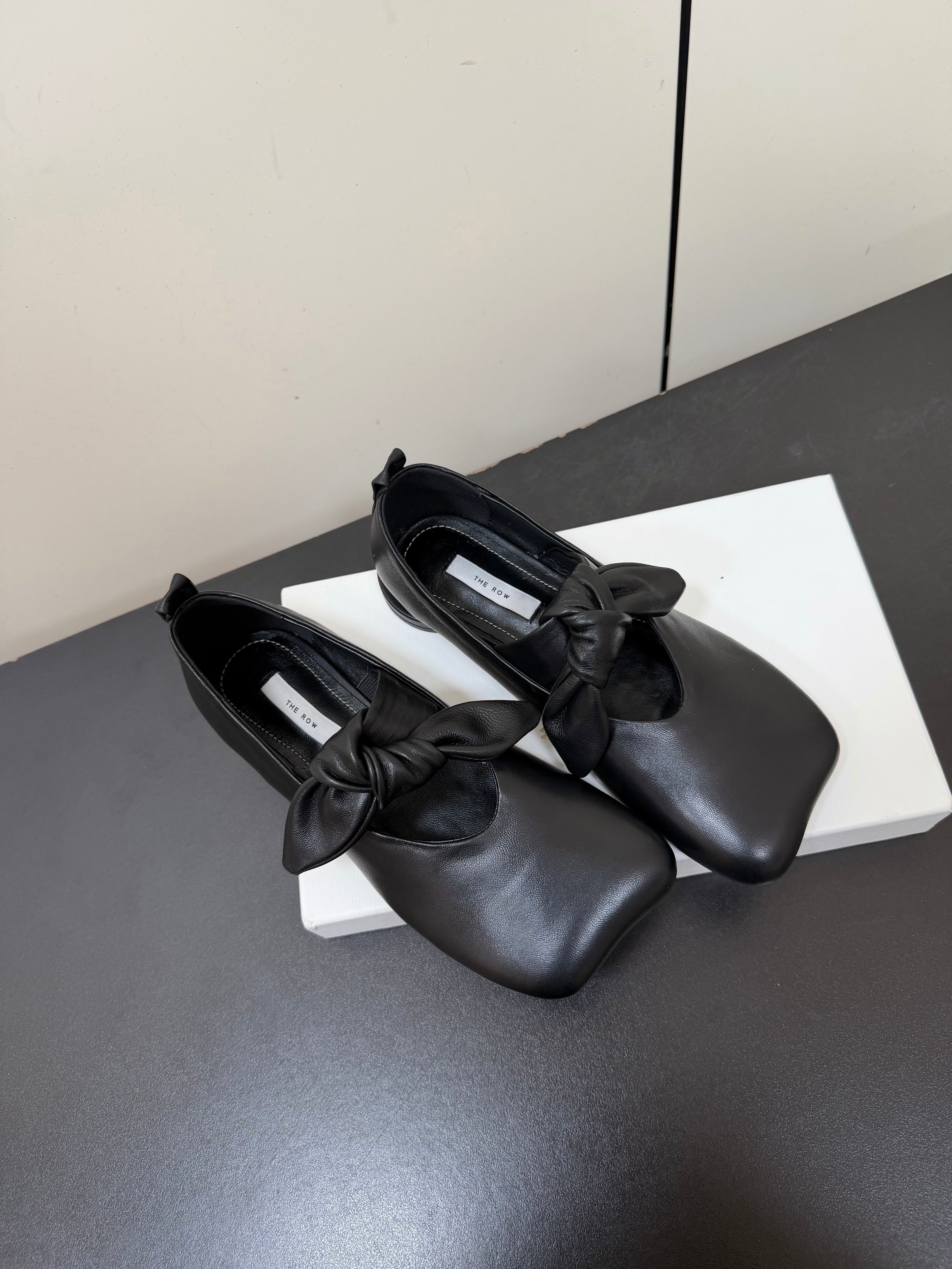 THE ROW 26S BALLET FLATS IN BLACK KNOT DETAIL CALFSKIN WITH SQUARE TOE