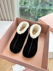 MIUMIU 26S ANKLE BOOTS IN BLACK SUEDE AND SHEARLING