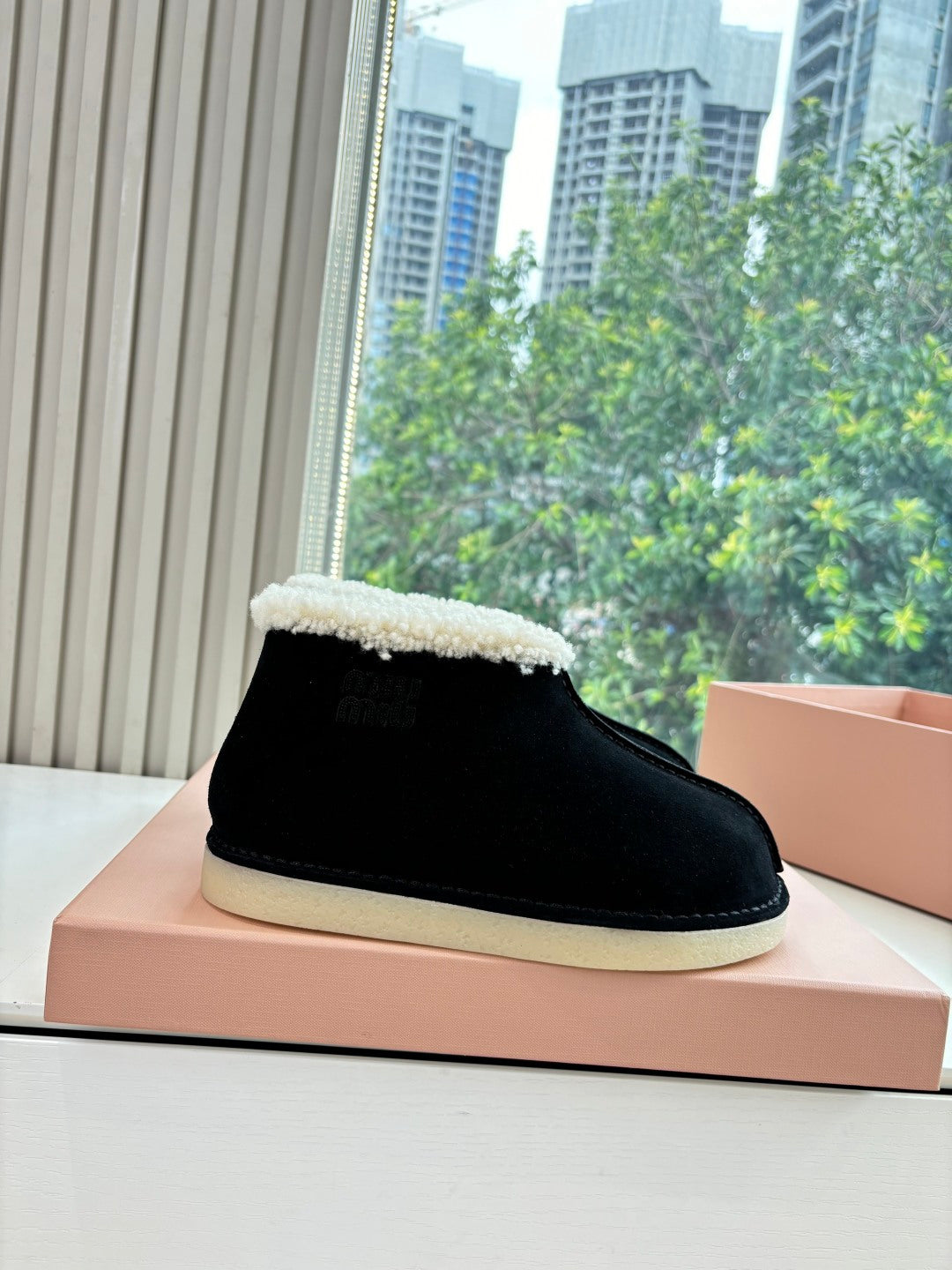 MIUMIU 26S ANKLE BOOTS IN BLACK SUEDE AND SHEARLING