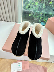 MIUMIU 26S ANKLE BOOTS IN BLACK SUEDE AND SHEARLING