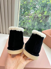 MIUMIU 26S ANKLE BOOTS IN BLACK SUEDE AND SHEARLING