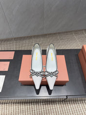 MIUMIU 26S POINTED TOE PUMPS 55MM IN WHITE AND BLACK CALFSKIN WITH BOW