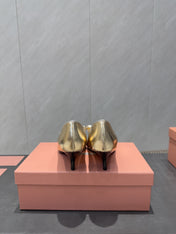 MIUMIU 26S POINTED TOE PUMPS 55MM IN GOLD CALFSKIN WITH BOW