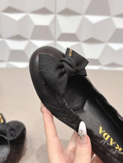 PRADA 26S ROUND TOE FLATS WITH BOW IN BLACK CALFSKIN