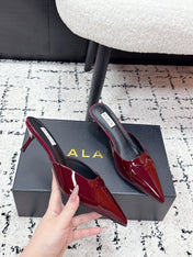 ALAIA 26S HEELED MULES 65 MM IN DARK RED GLOSSY CALFSKIN