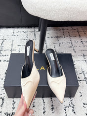 ALAIA 26S HEELED MULES 65 MM IN IVORY BEIGE SATIN
