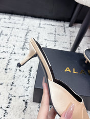 ALAIA 26S HEELED MULES 65 MM IN IVORY BEIGE SATIN