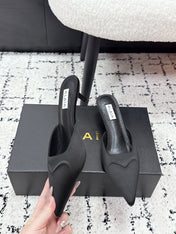 ALAIA 26S HEELED MULES 65 MM IN BLACK SATIN