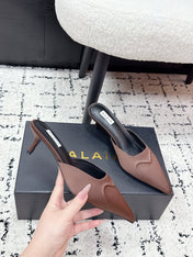 ALAIA 26S HEELED MULES 65 MM IN CHOCOLATE BROWN SATIN