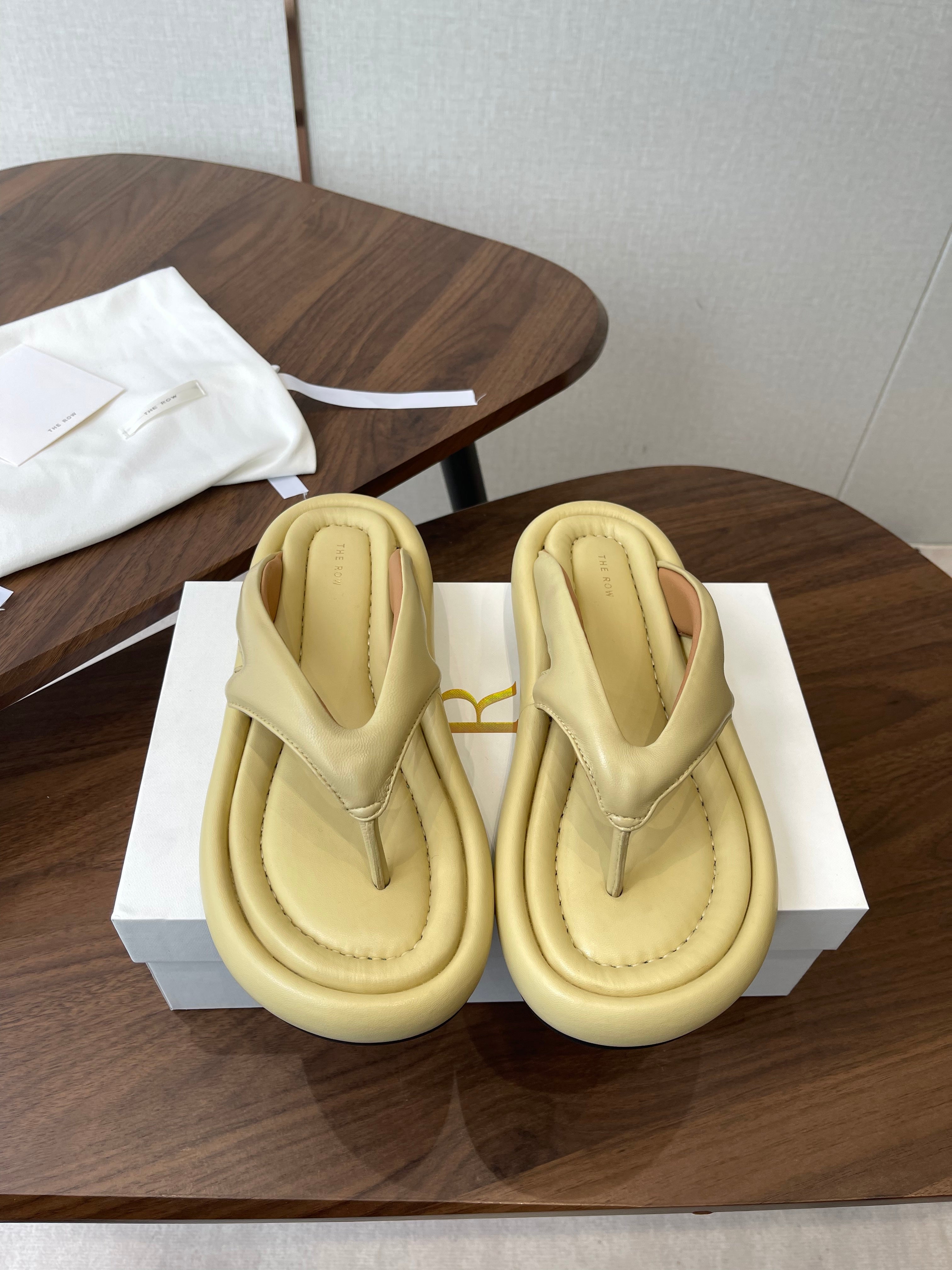 THE ROW 26S PUFFED THONG SANDALS IN BUTTER YELLOW CALFSKIN