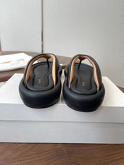 THE ROW 26S PUFFED THONG SANDALS IN BLACK CALFSKIN