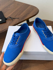CELINE 26S TRIOMPHE LOW TOP SNEAKERS IN BLUE CANVAS RED TRIM