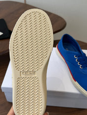 CELINE 26S TRIOMPHE LOW TOP SNEAKERS IN BLUE CANVAS RED TRIM