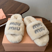 MIUMIU 26S CRYSTAL LOGO SLIDES IN LIGHT BEIGE SHEARLING