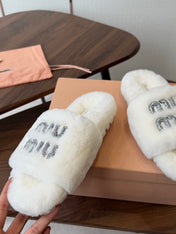 MIUMIU 26S CRYSTAL LOGO SLIDES IN WHITE SHEARLING