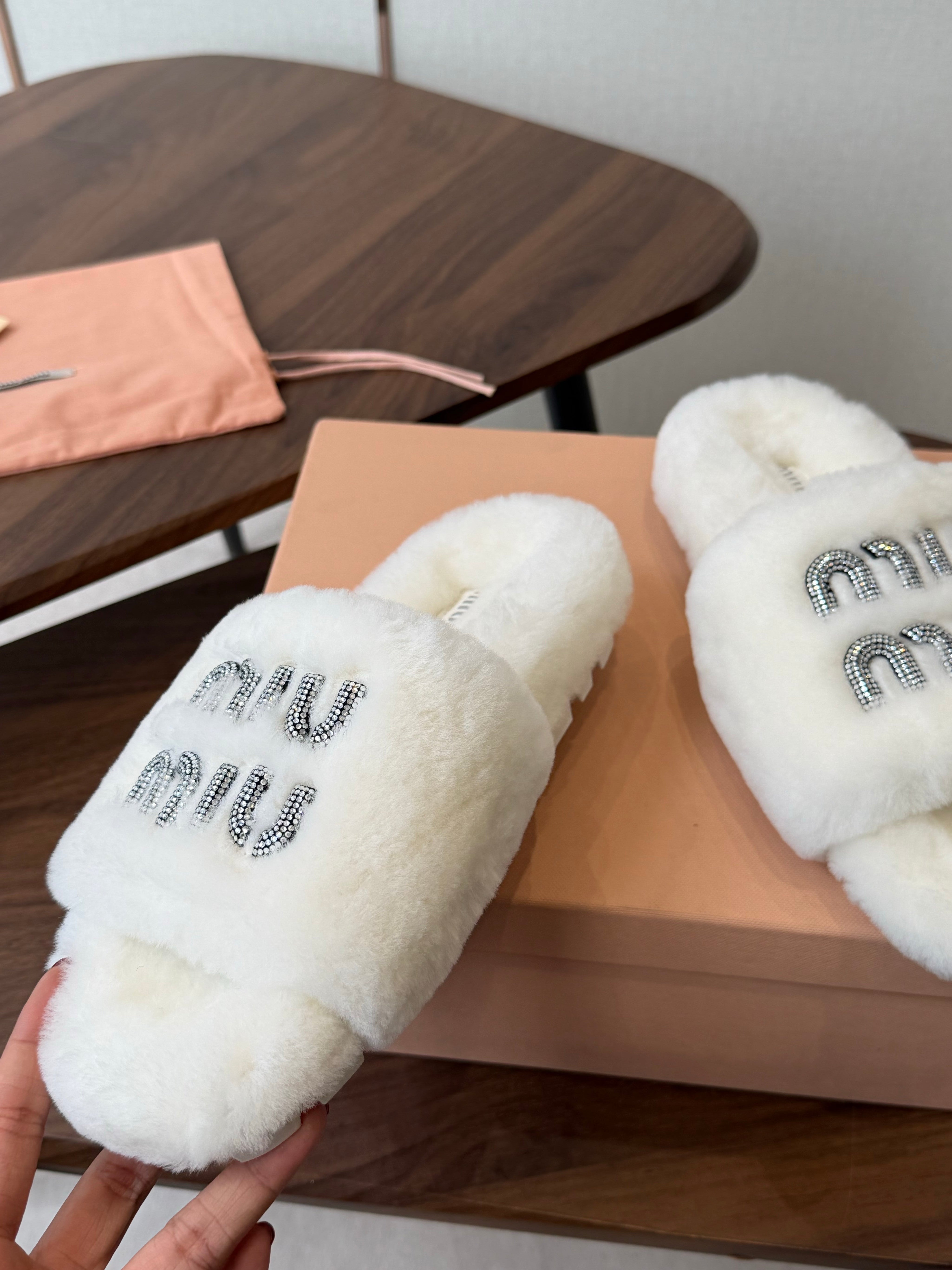 MIUMIU 26S CRYSTAL LOGO SLIDES IN WHITE SHEARLING
