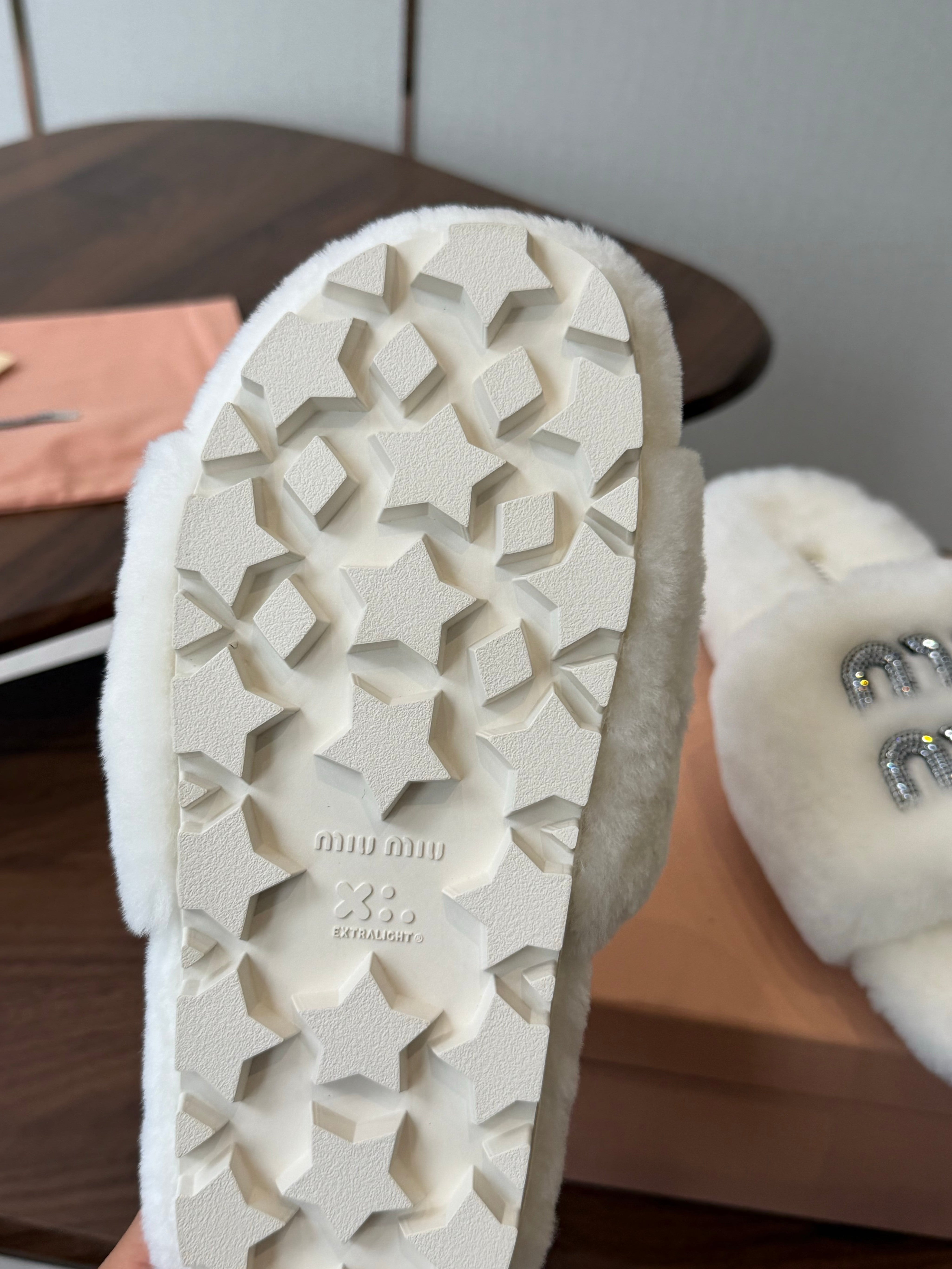 MIUMIU 26S CRYSTAL LOGO SLIDES IN WHITE SHEARLING