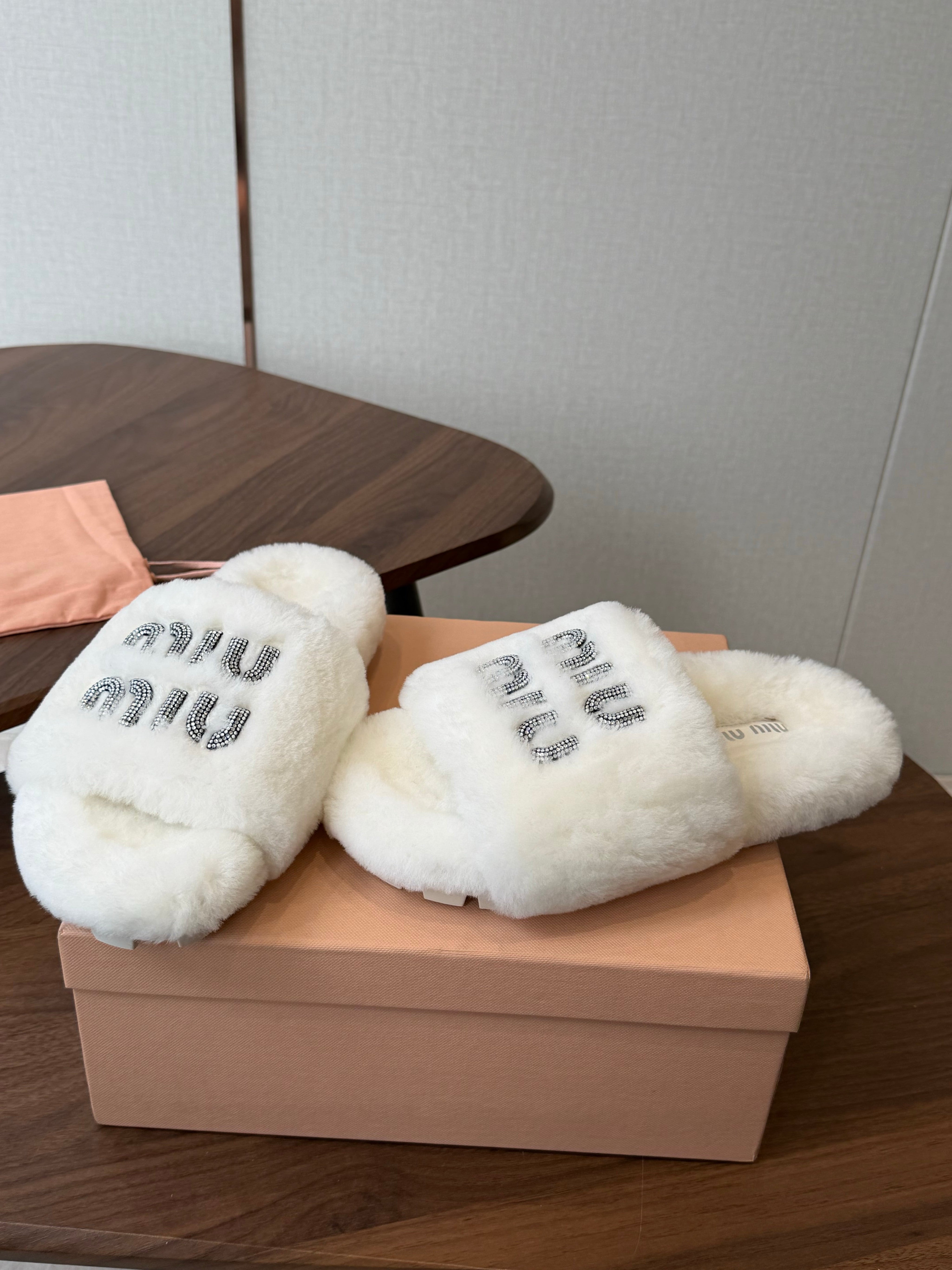 MIUMIU 26S CRYSTAL LOGO SLIDES IN WHITE SHEARLING