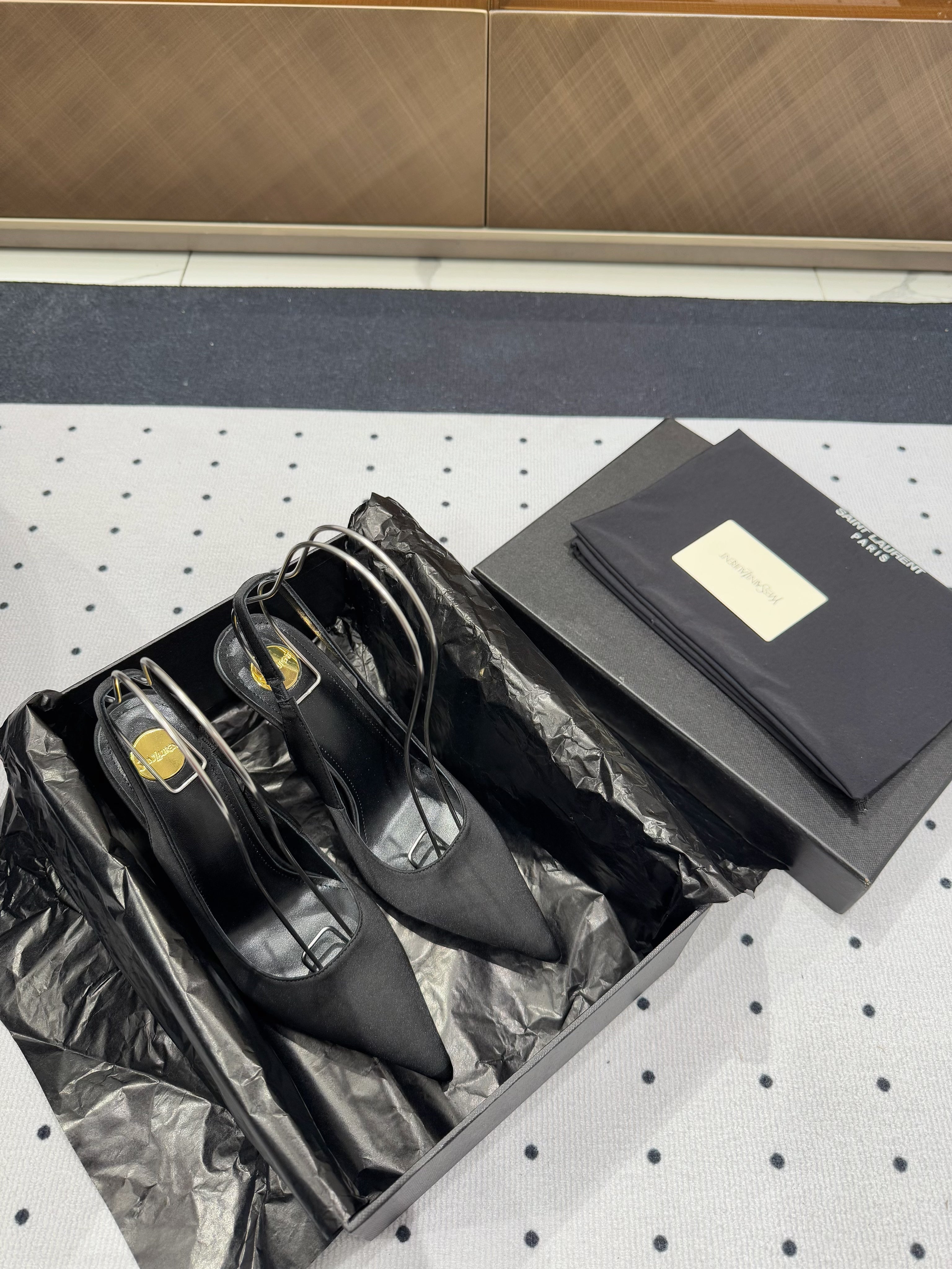 L'ENTRACTE SLINGBACK PUMPS IN BLACK SATIN