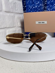 MIUMIU 26S RECTANGULAR FRAME IN METAL 426398