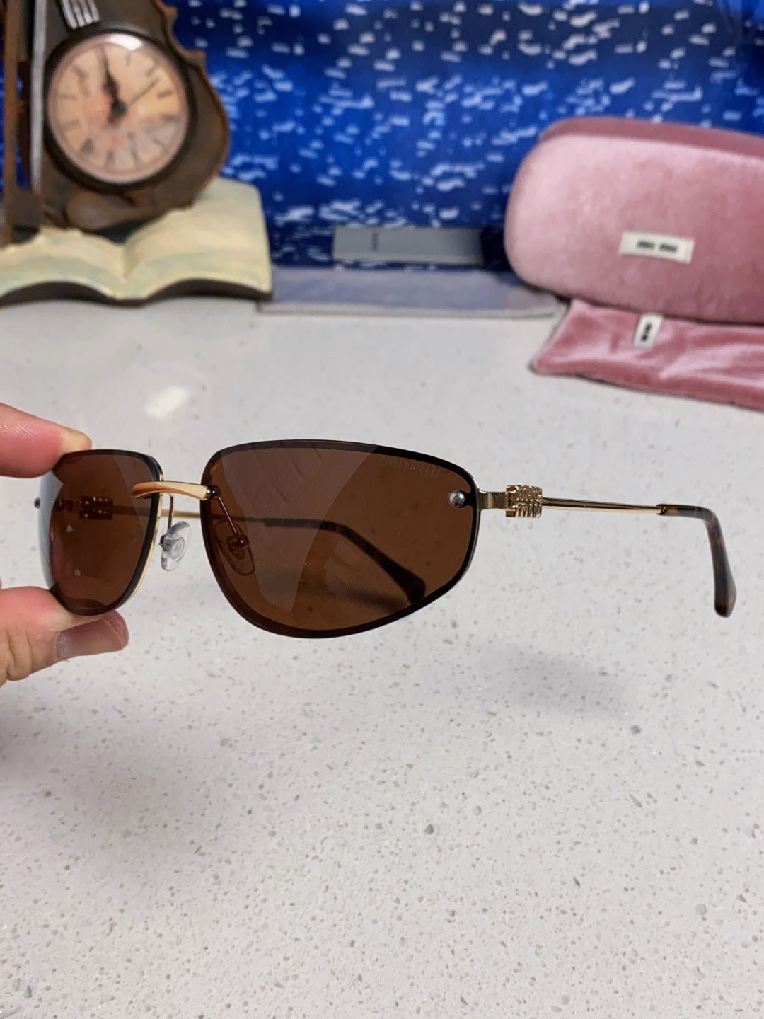 MIUMIU 26S RECTANGULAR FRAME IN METAL 426398