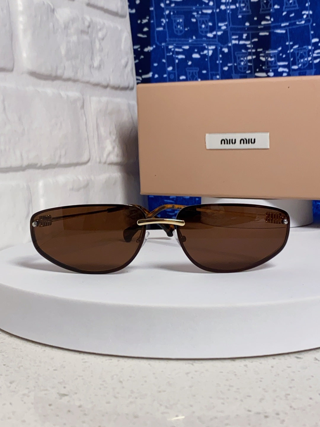 MIUMIU 26S RECTANGULAR FRAME IN METAL 426398