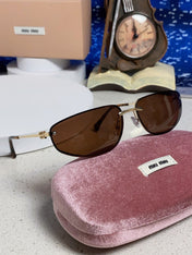 MIUMIU 26S RECTANGULAR FRAME IN METAL 426398