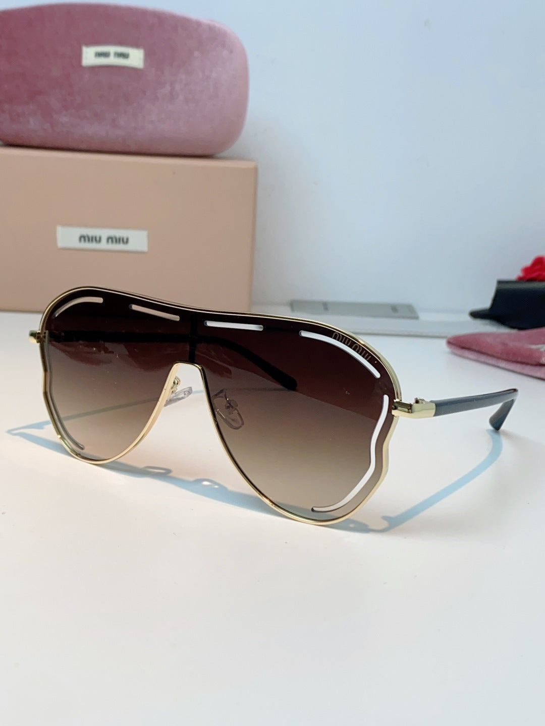 MIUMIU 26S SHIELD FRAME IN METAL 424496